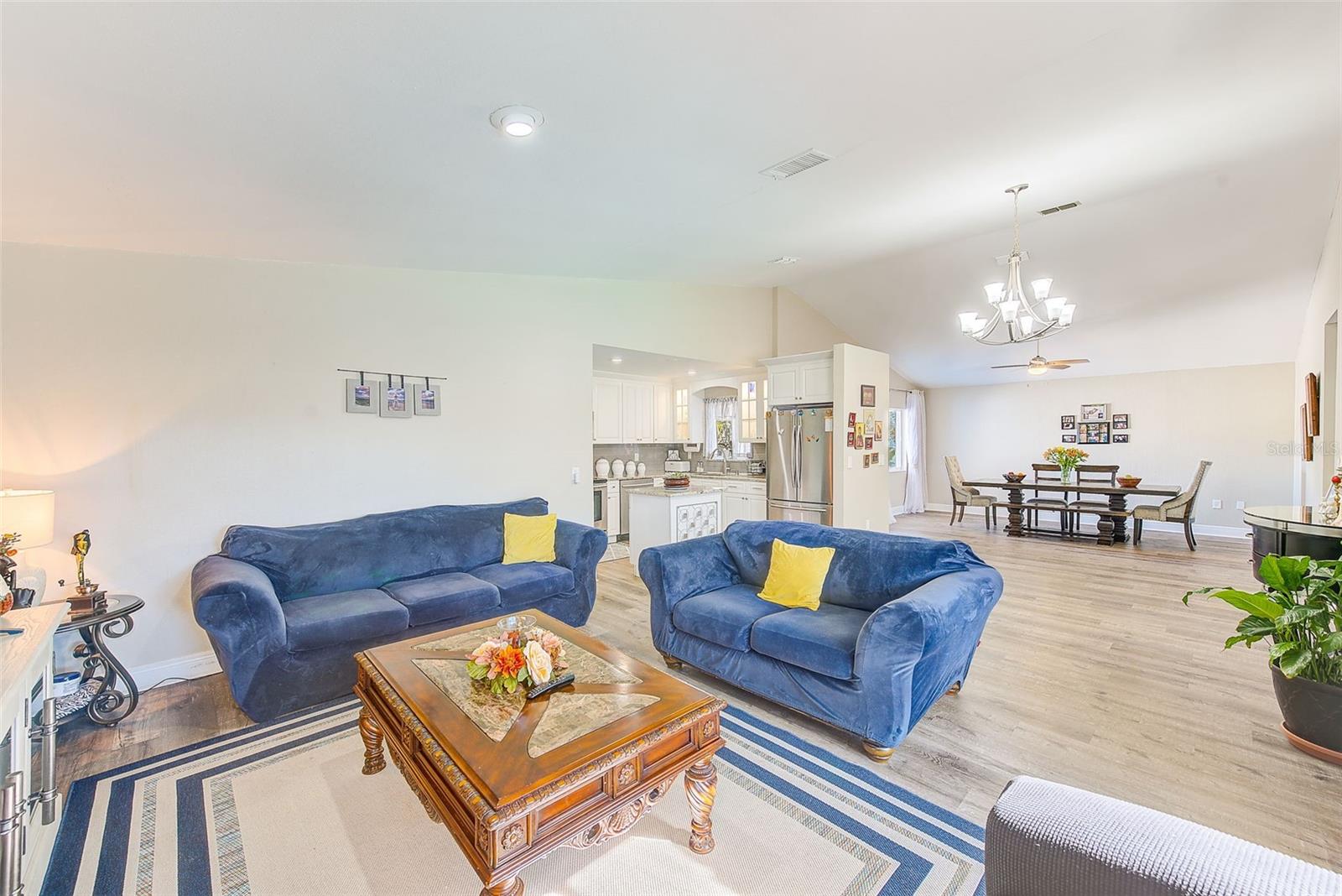 View of living room, dining room and kitchen