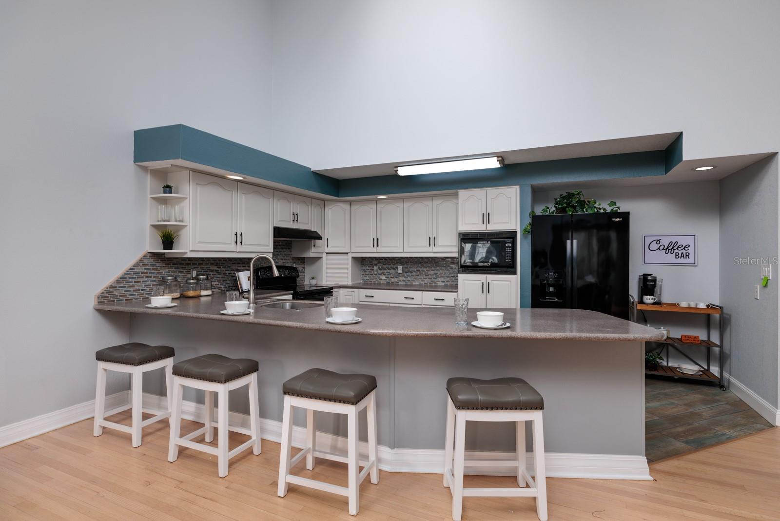 Updated Kitchen with long countertop: Great for casual dining and extra counter space.