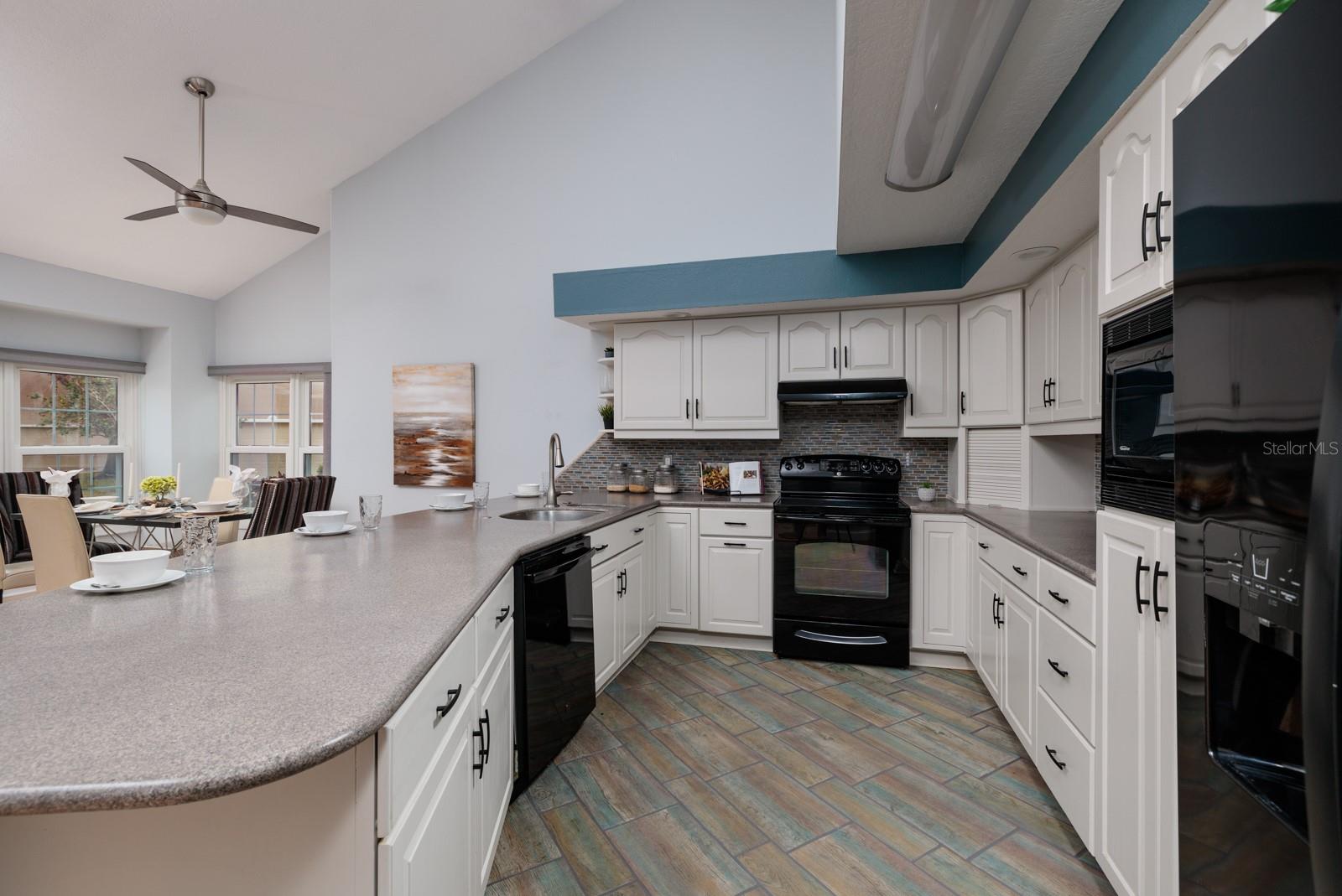 Remodeled Kitchen extras: Under counter lighting, resurfaced Corian countertops,appliance garage, built in microwave and lots of cabinet space.