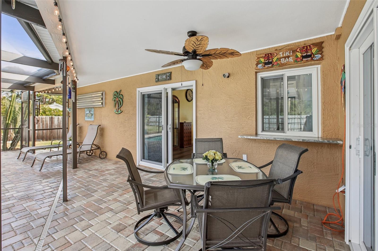 Gorgeous screened enclosed pool with pavers.