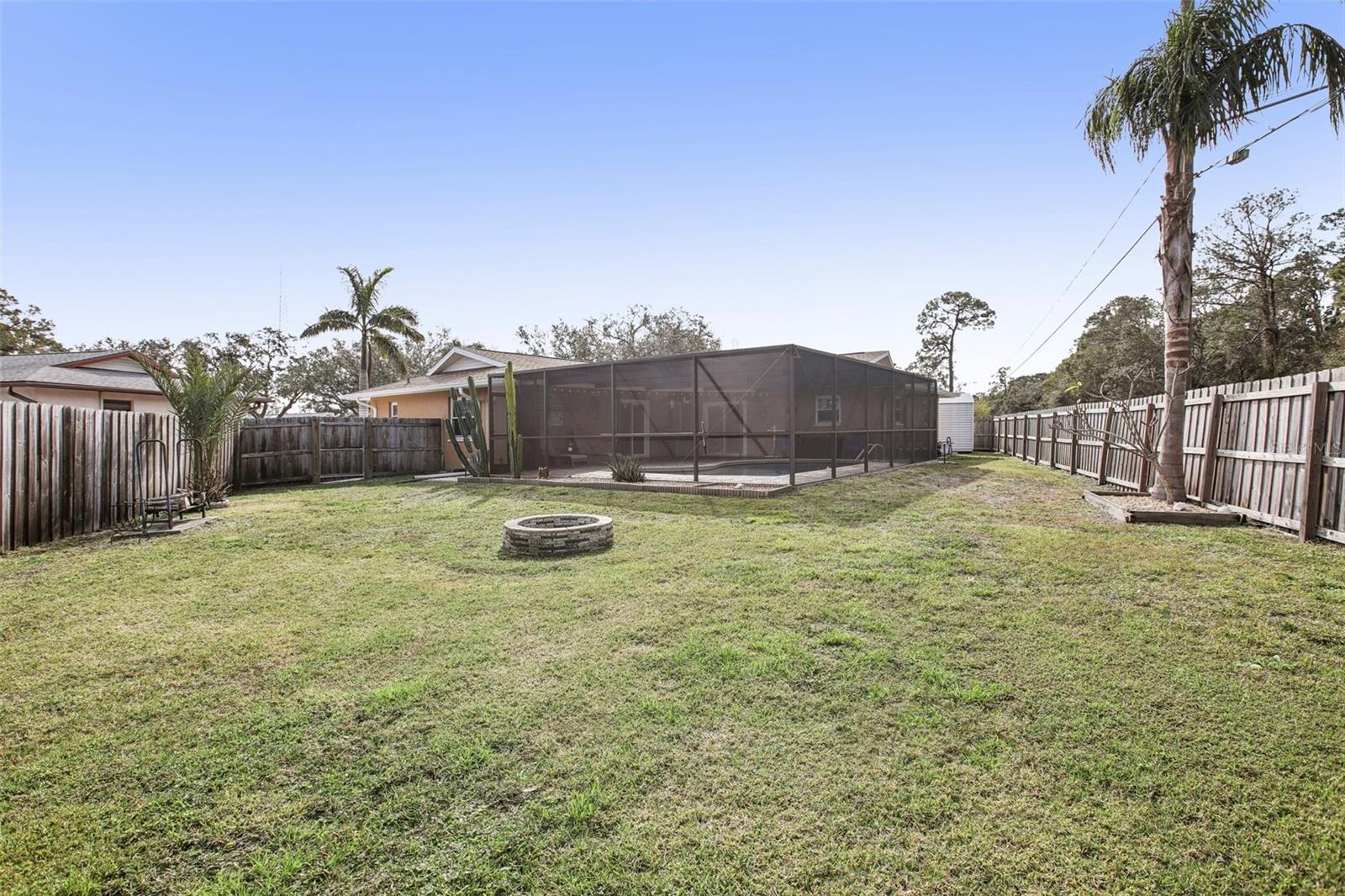 Over-sized lot and huge back yard with granite fire pit.