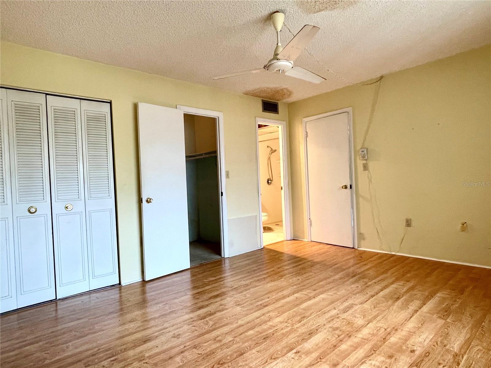 Primary bedroom with ensuite bath, and regular and walk-in closet