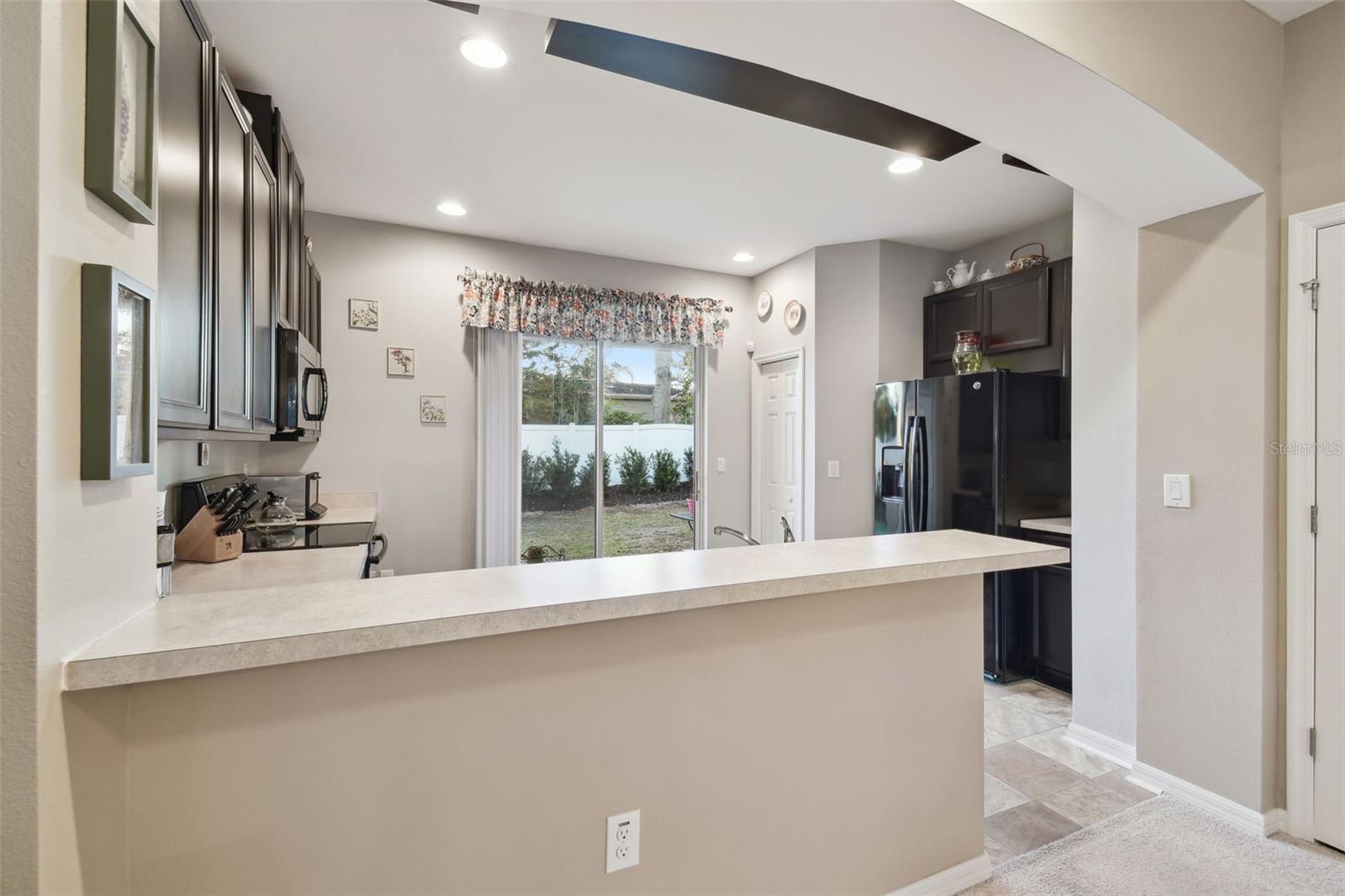 Kitchen view.  Breakfast bar has ample room for several bar stools.