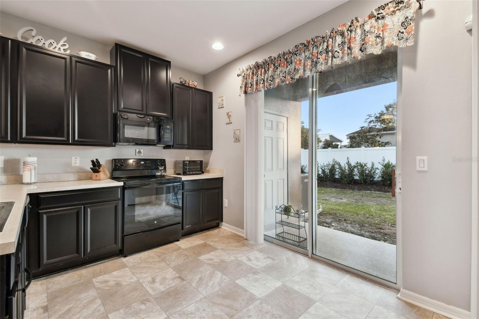 Open kitchen space with plenty of cabinetry.