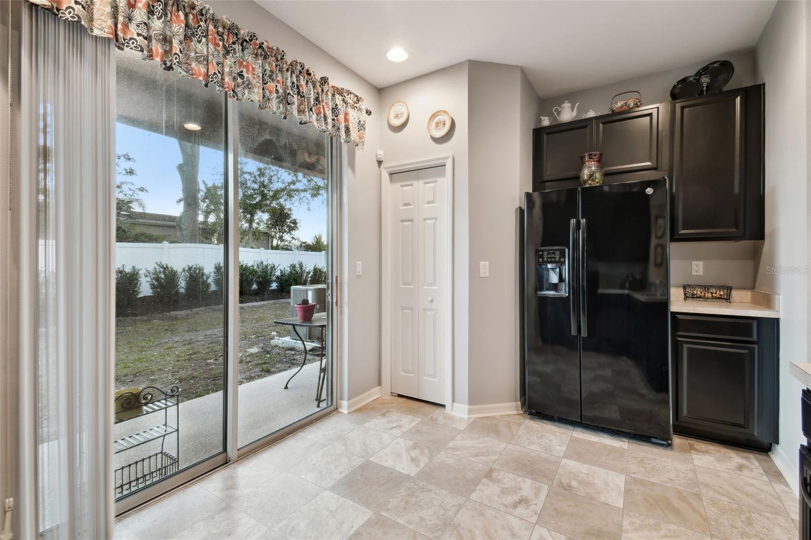 Closet pantry and sliders out to the backyard.