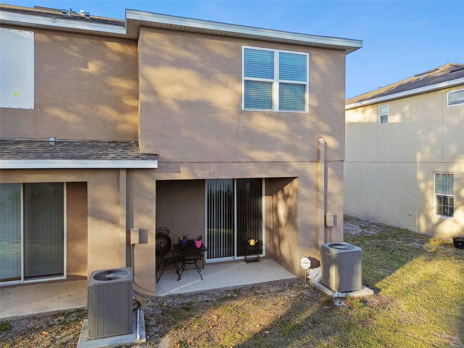 Backyard view of townhome.