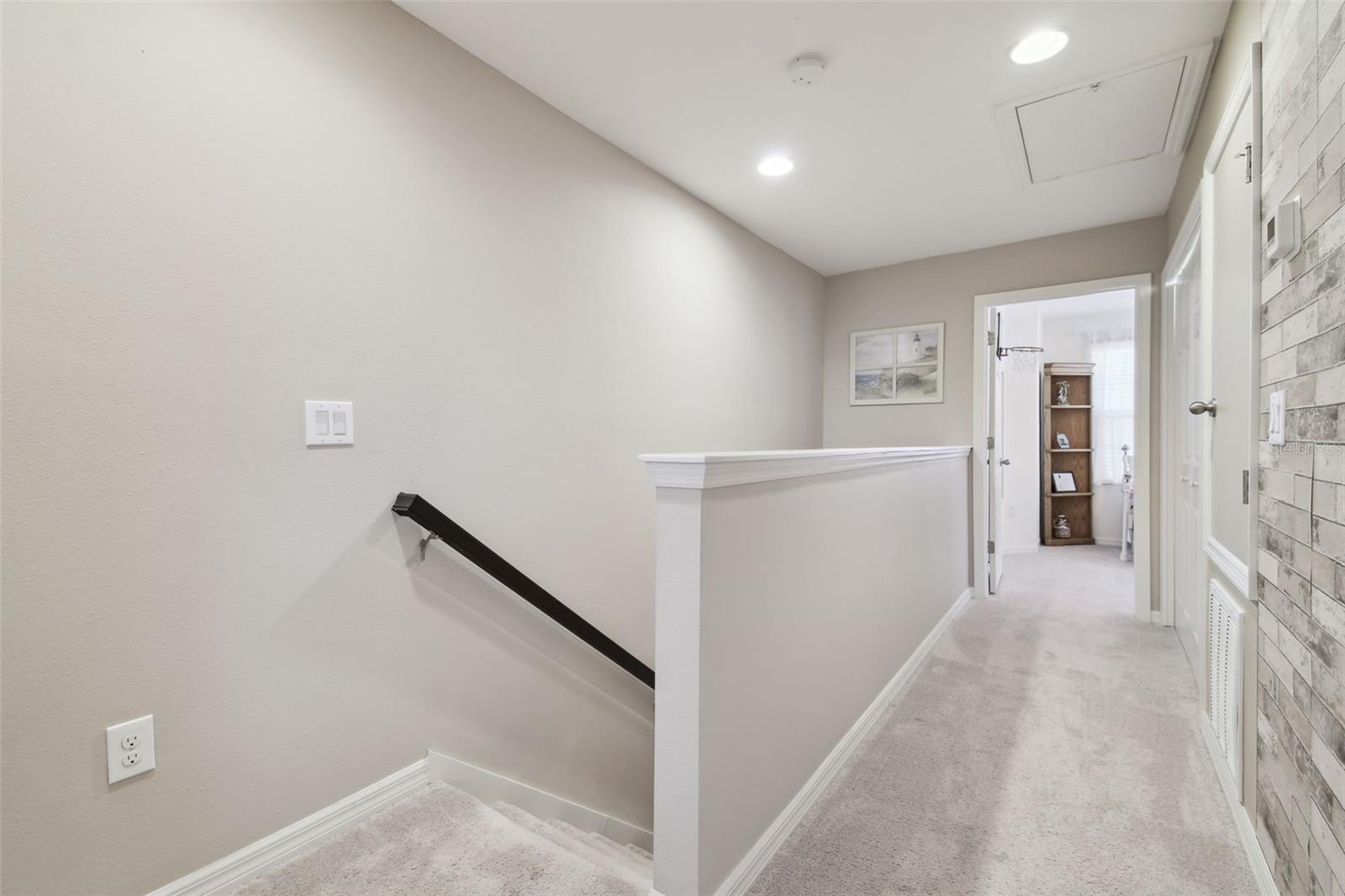 View from upstairs hallway.  Room at the end is the front bedroom.