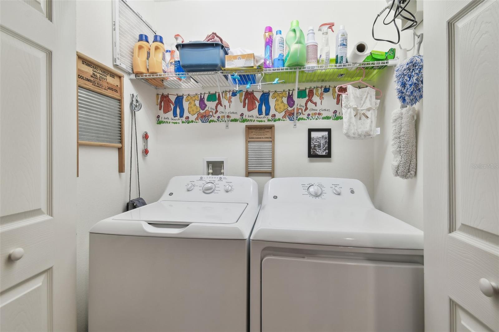 Laundry closet along hallway. Washer and dryer will convey.