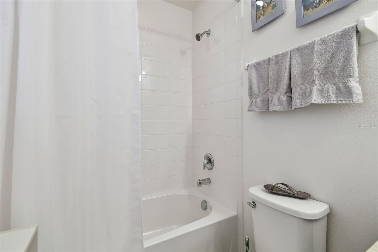 Second bedroom ensuite with tub and shower.