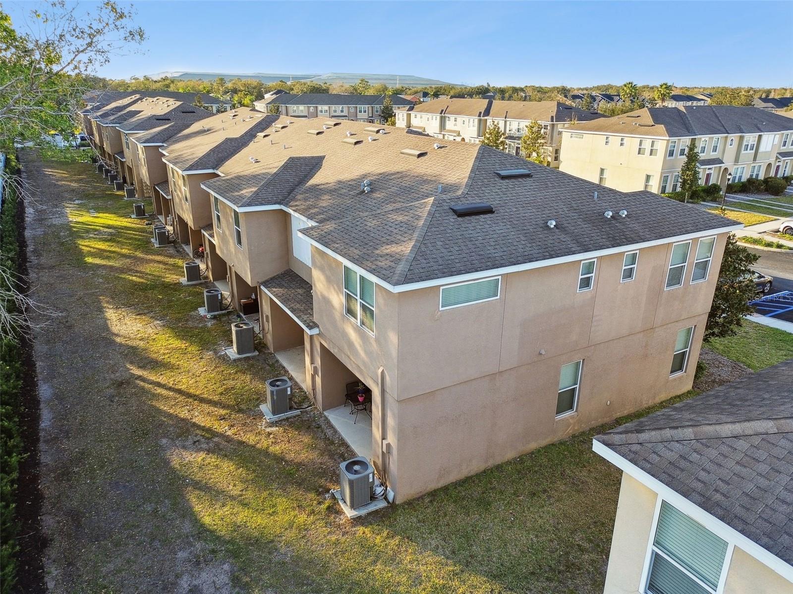 Aerial view of the back of the townhomes.