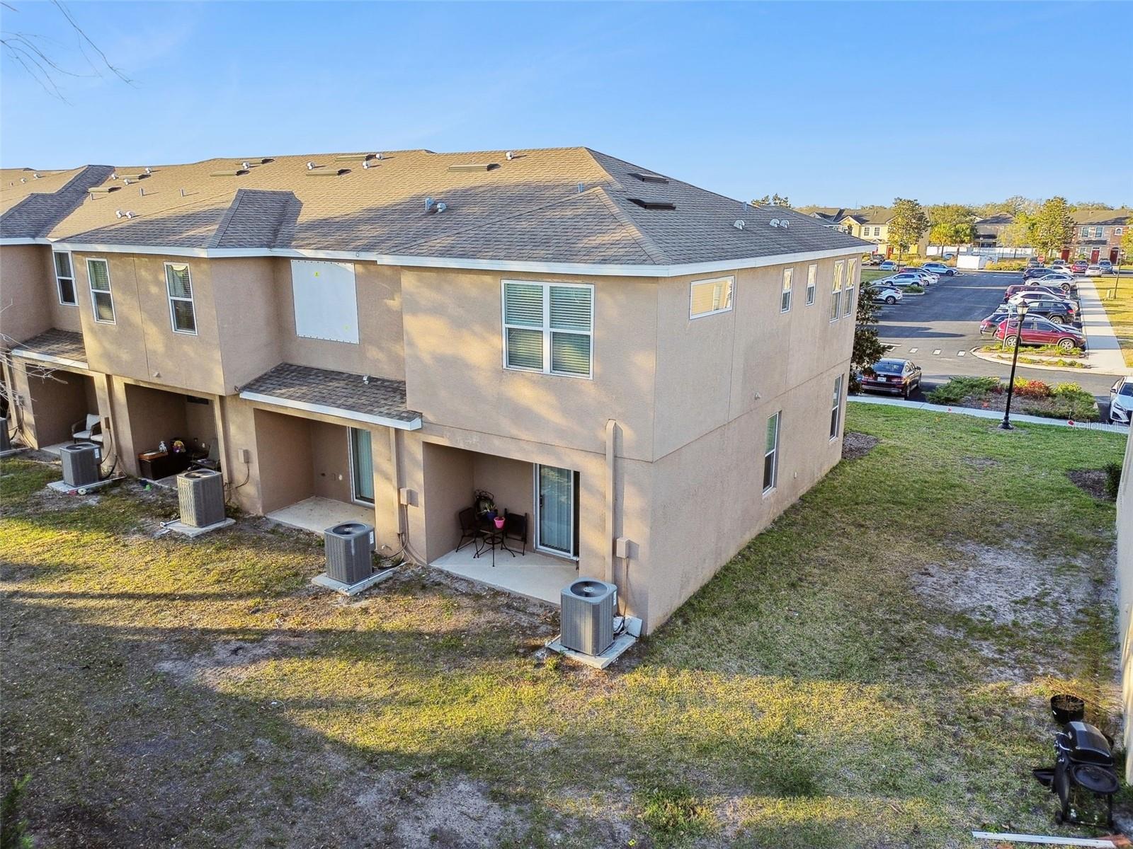 Aerial view of the rear of the townhome.