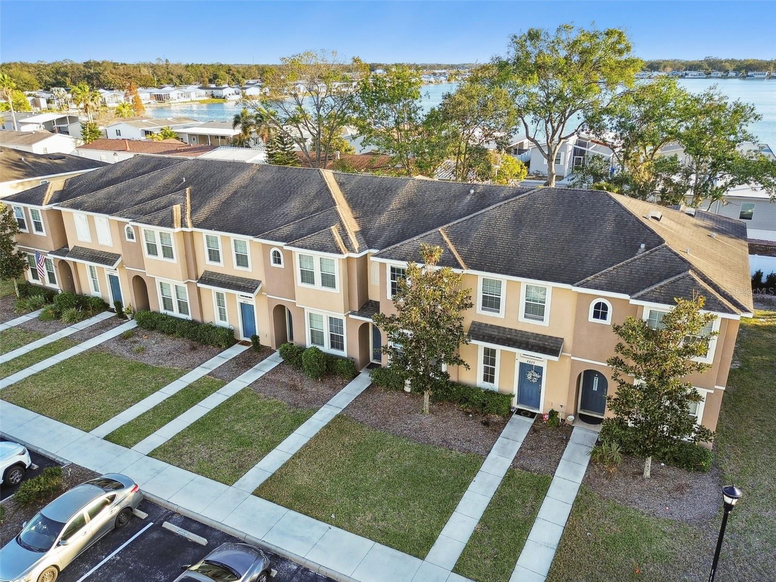 Aerial view of the townhomes. Have sidewalks and lighting.