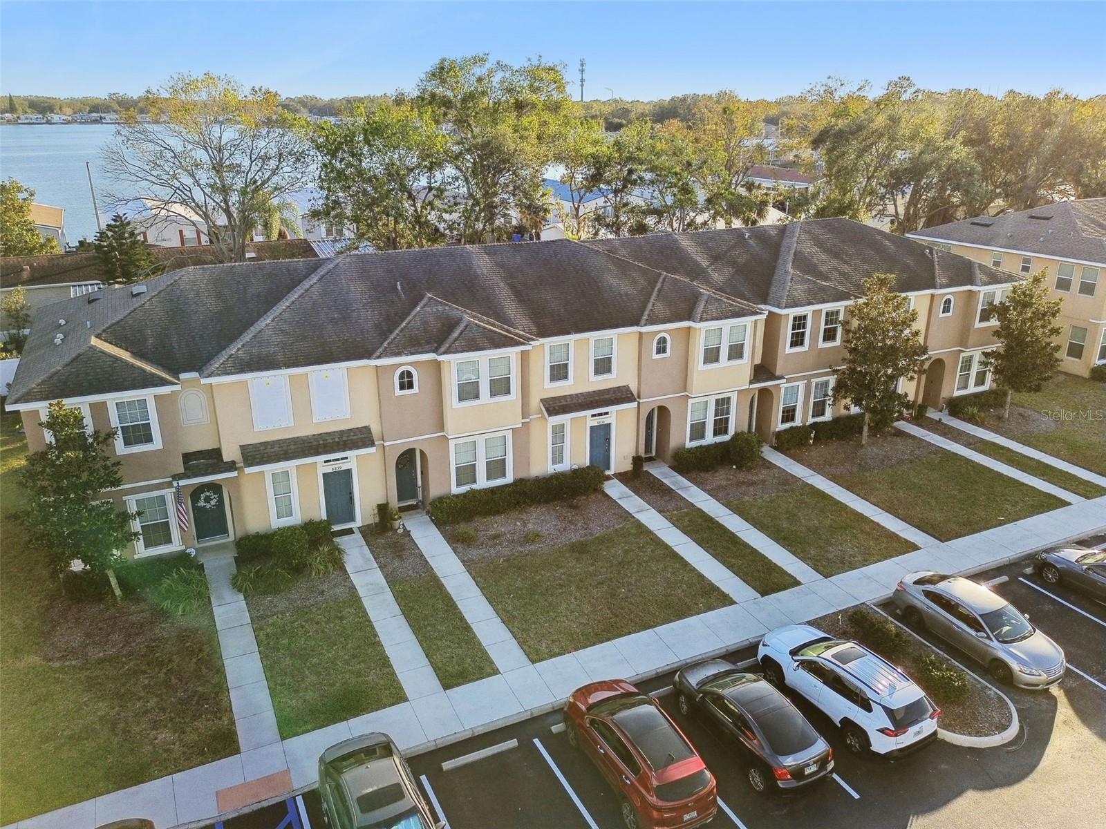 Aerial view of the townhomes and community behind.