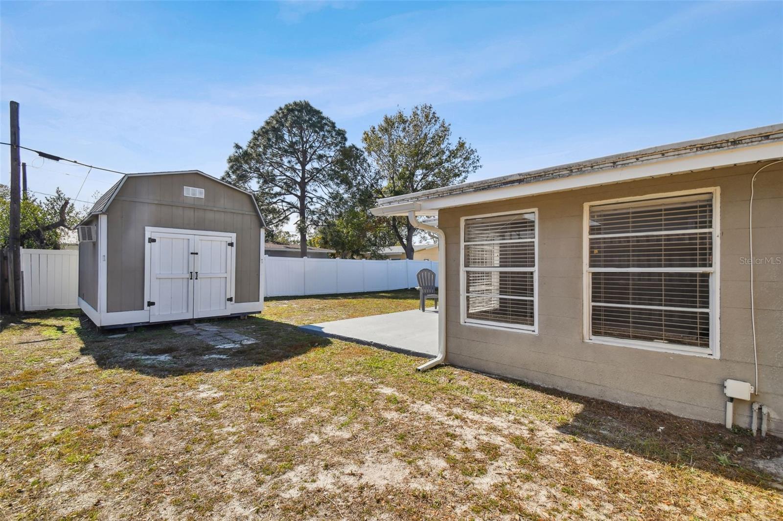 Fenced in backyard and storage shed included