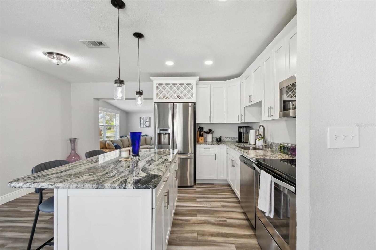 Your upgraded kitchen with a bar area to sit