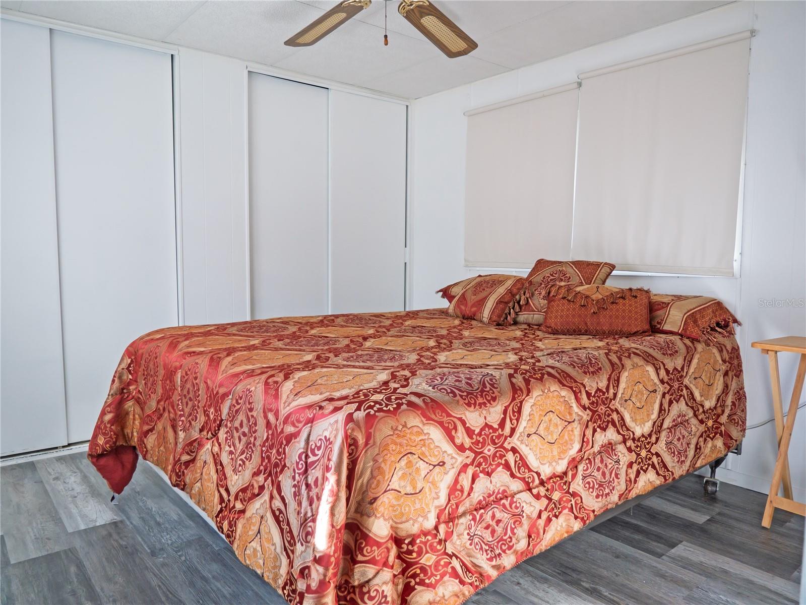 The primary bedroom has plenty of closet space. This room fits this queen size bed.