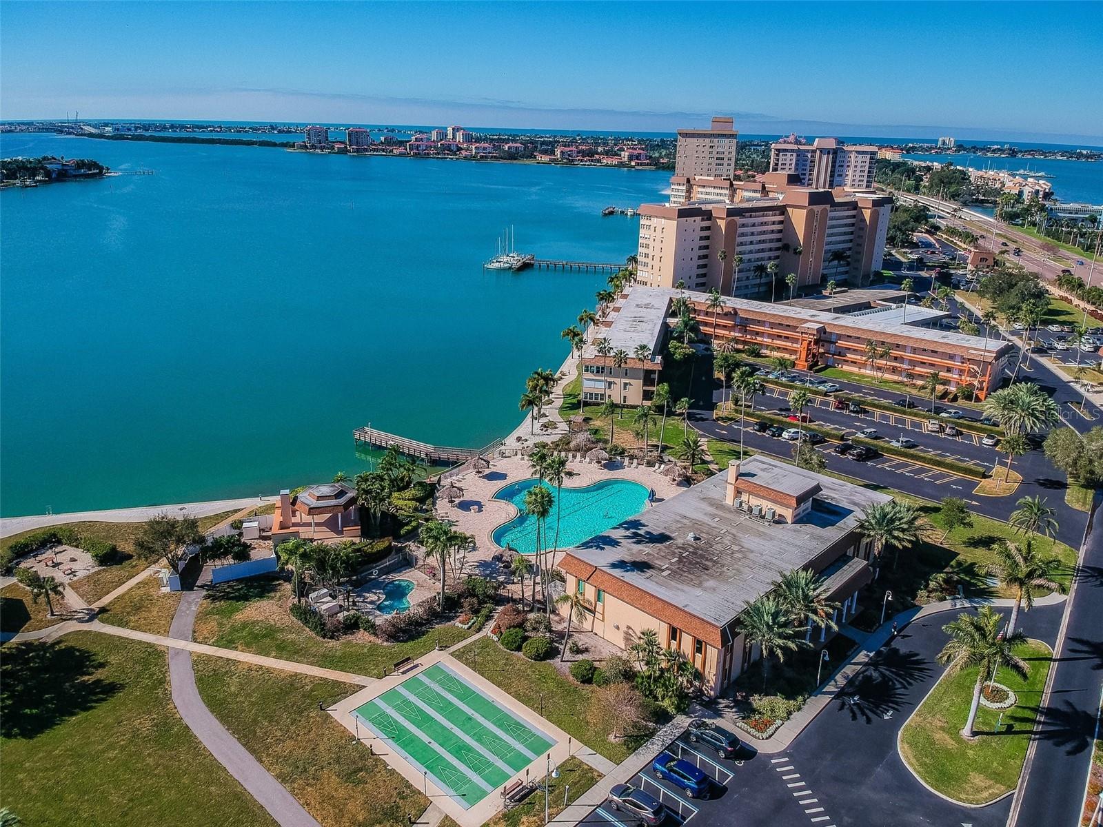 This lovely two-bedroom, two-bathroom condominium, showcases captivating views of Boca Ciega Bay