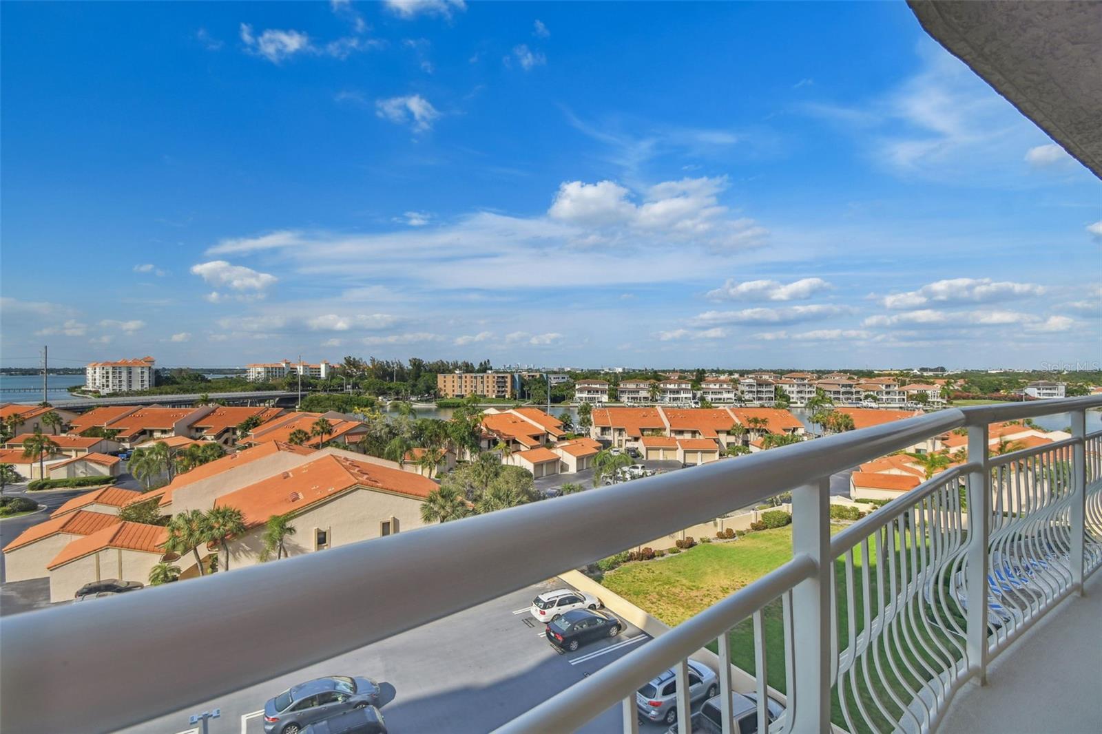 This 7th-floor, corner unit boasts a 30-foot balcony accessible from both the spacious living room and each bedroom, offering an enchanting retreat at any time of day