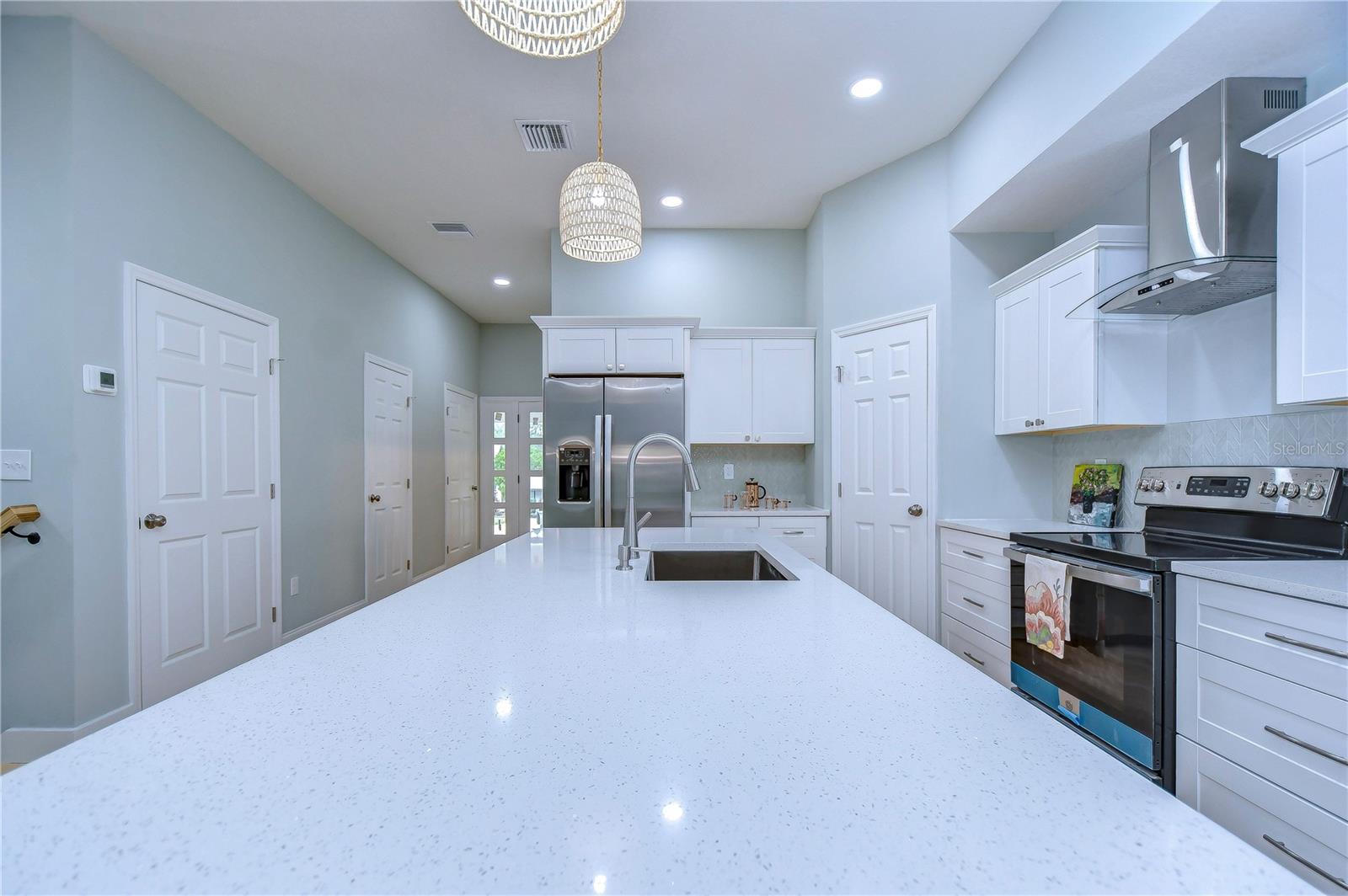 The oversized kitchen island makes meal prep a breexe!