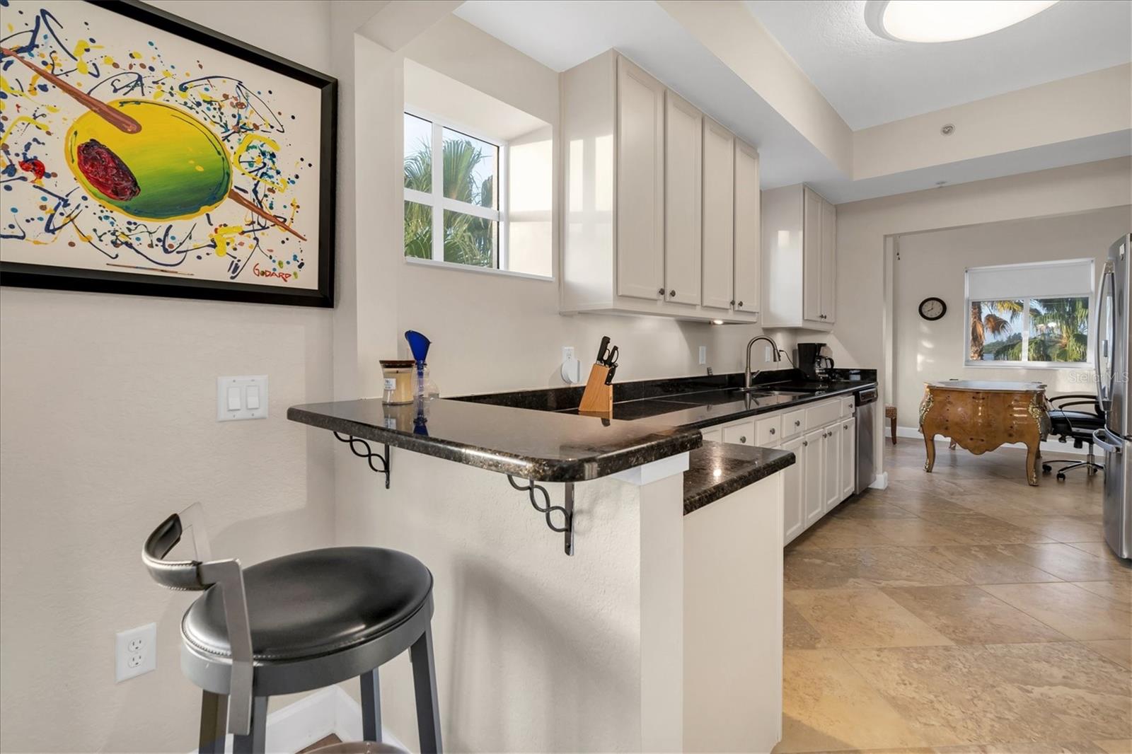 Breakfast bar connects the dining room and kitchen