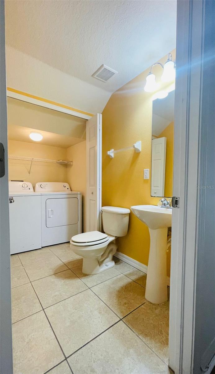 Half Bath with Laundry Closet 1st FL