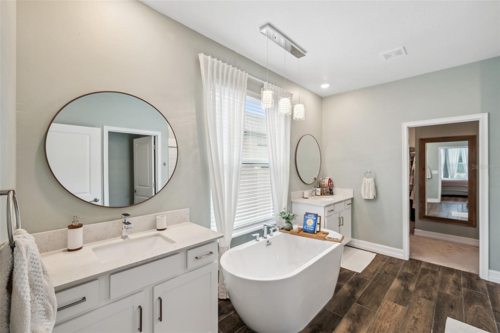 Primary Bathroom with dual vanities and soaker tub