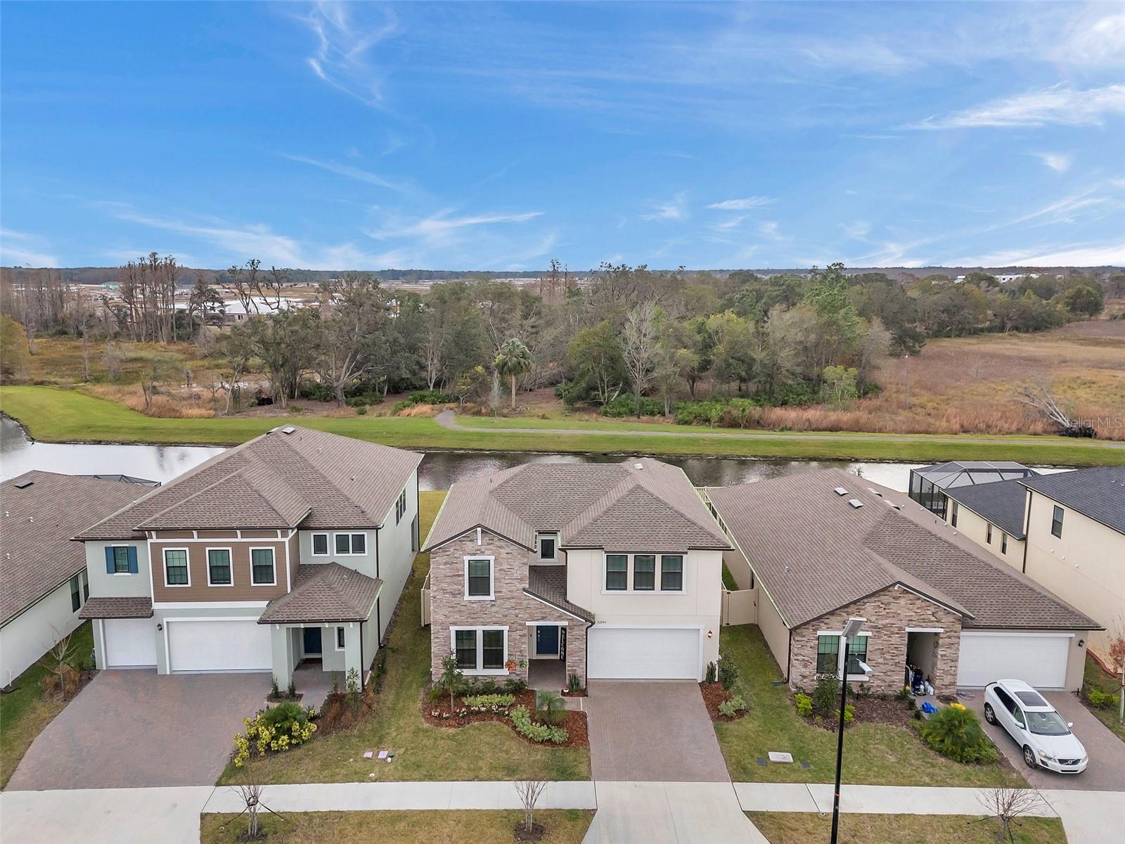 Front Exterior drone overlooking preserve