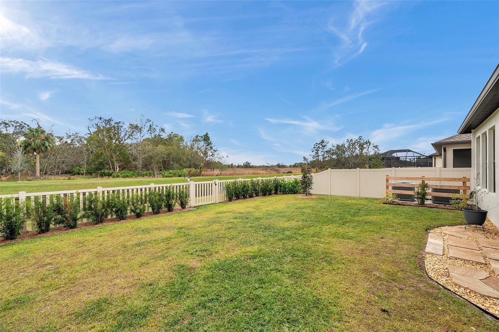 Back yard fenced and landscaped