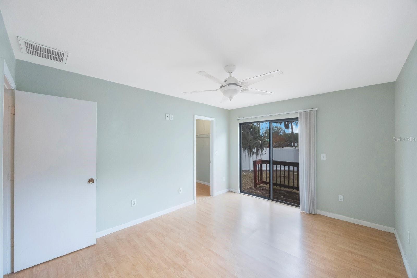 Master Bedroom opens up to the fenced backyard