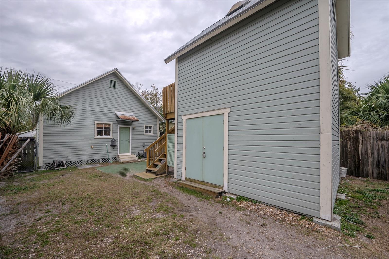 2-story 12x12 tiny house; shed on bottom, studio on top.