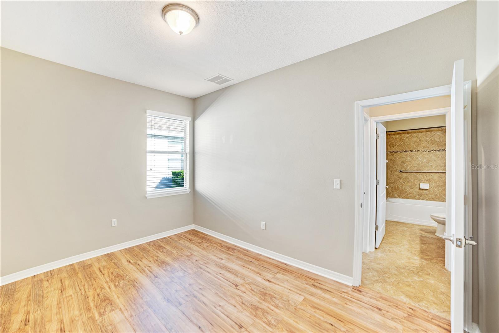 BEDROOM 2 AND 3 LOCATED IN A HALLWAY OFF THE FAMILY ROOM OFFERING PRIVACY FROM MASTER SUITE