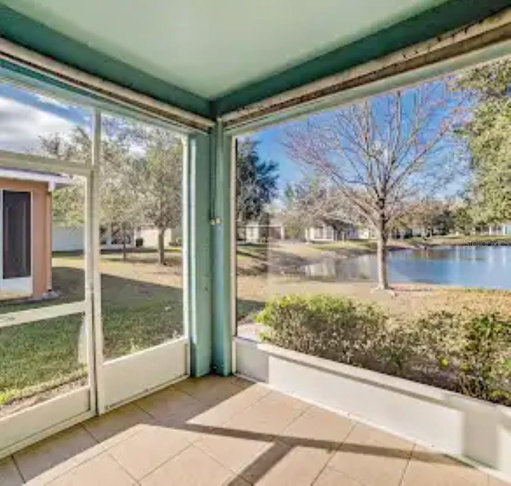 SCREENED LANAI WITH BEAUTIFUL VIEW OF POND