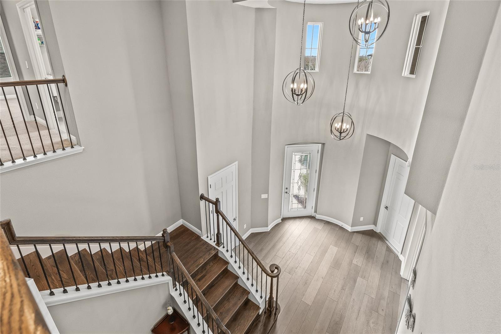 Grand foyer and upgraded railings and staircase.