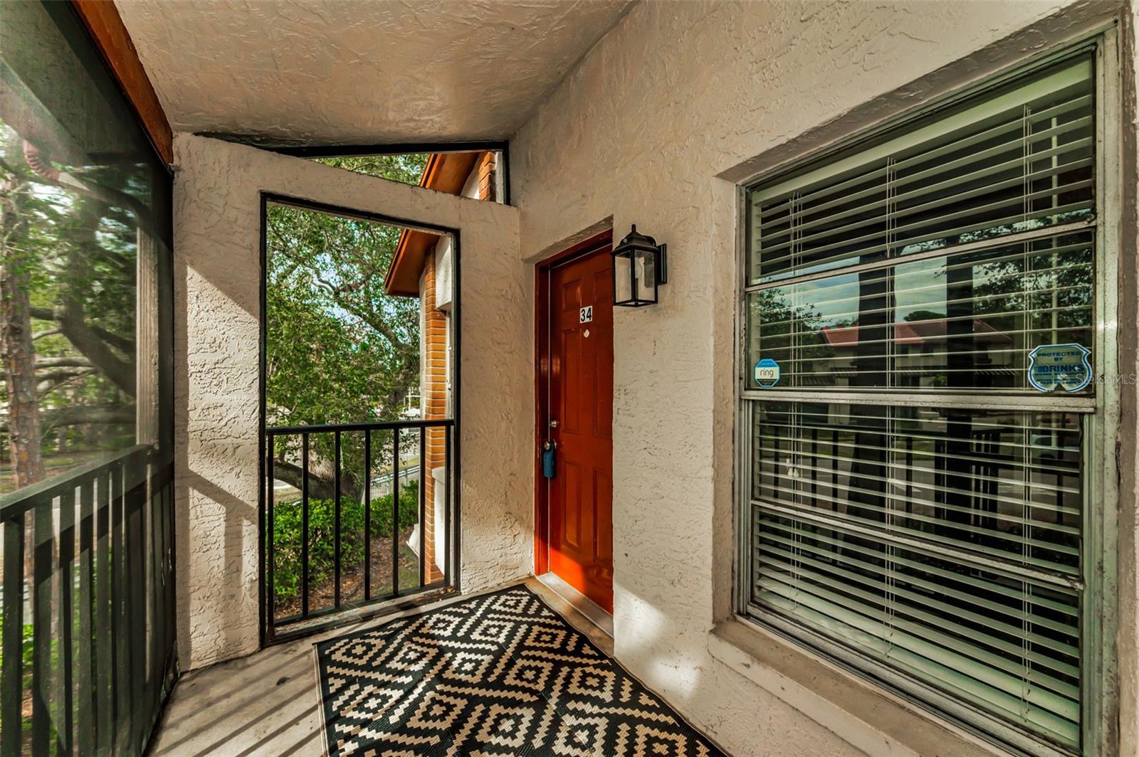 Front door and screened balcony