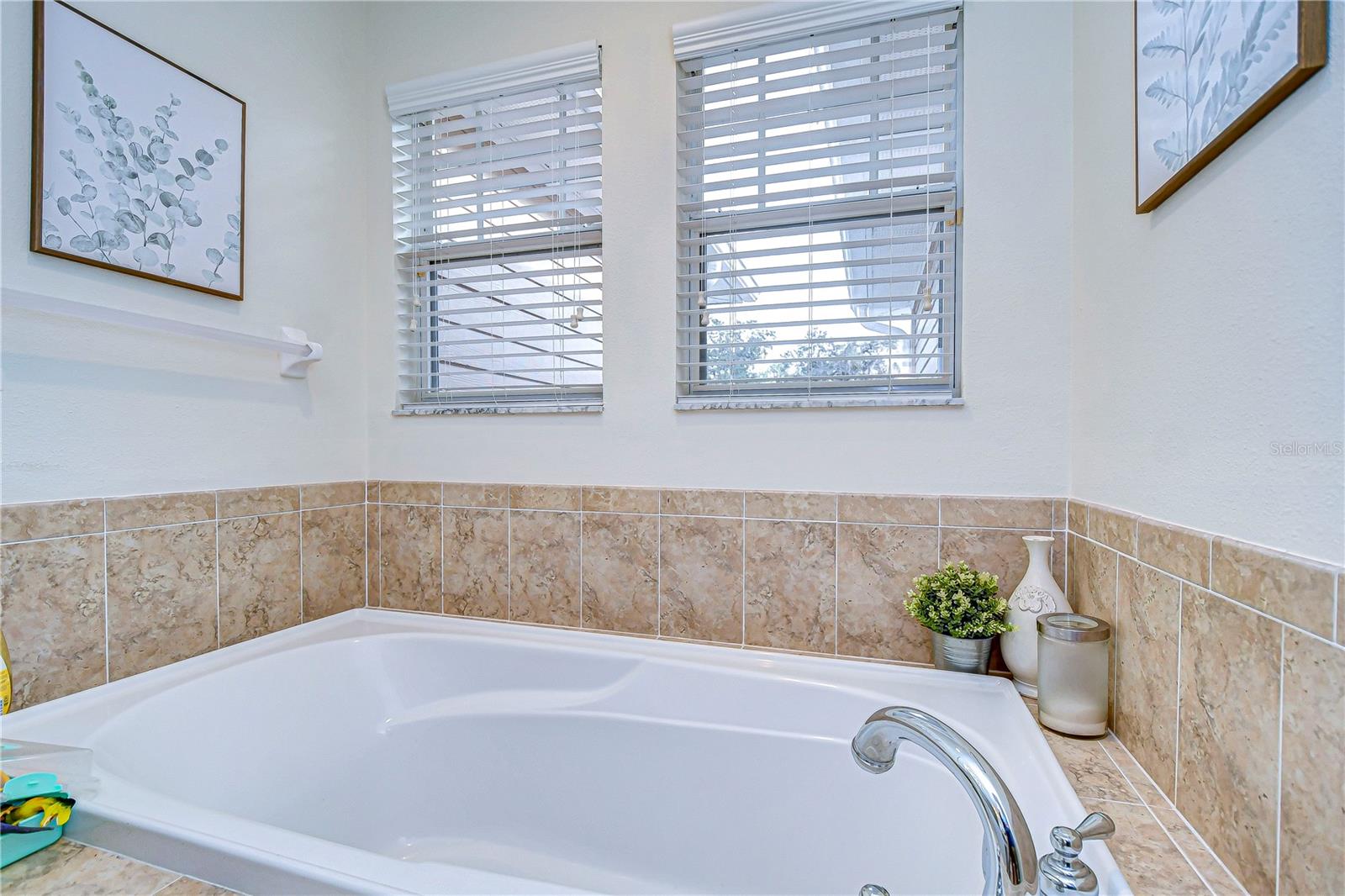 Soaking tub located in primary bathroom.