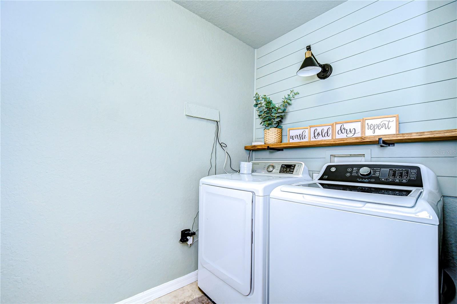 Laundry room with shiplap wall!