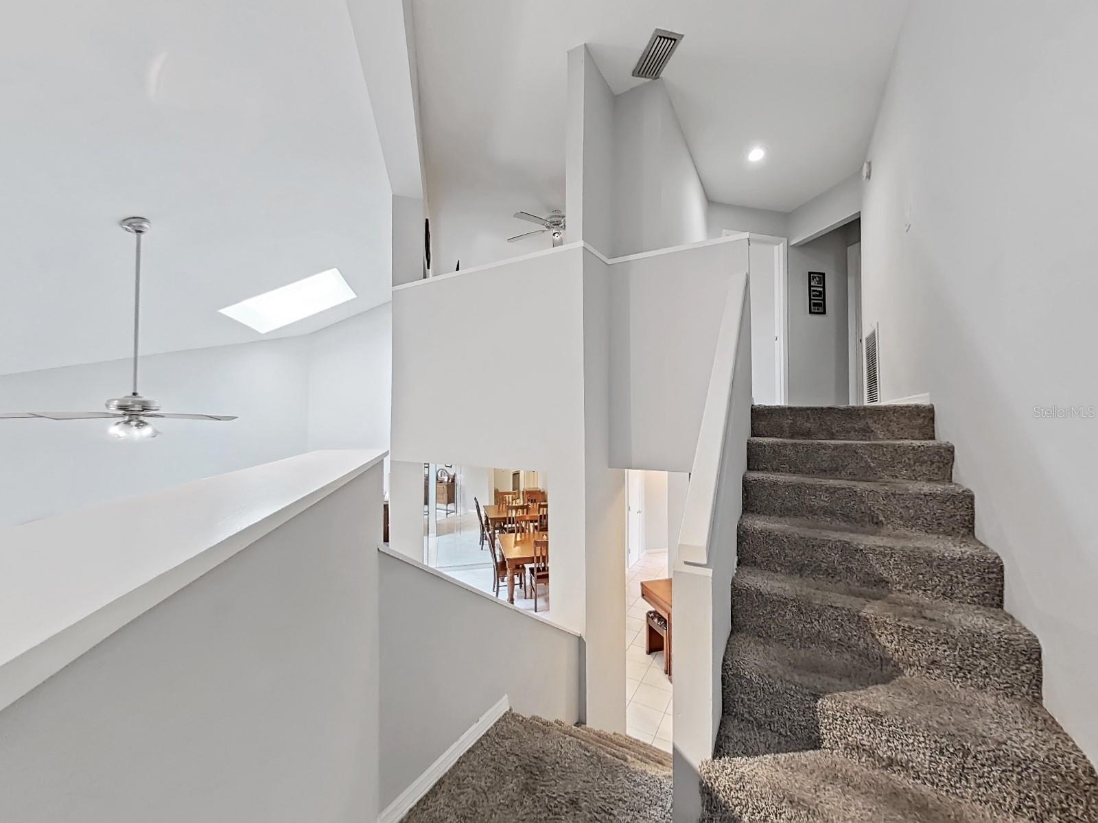 Staircase leading to Bedroom 2/Loft and Master Bedroom.