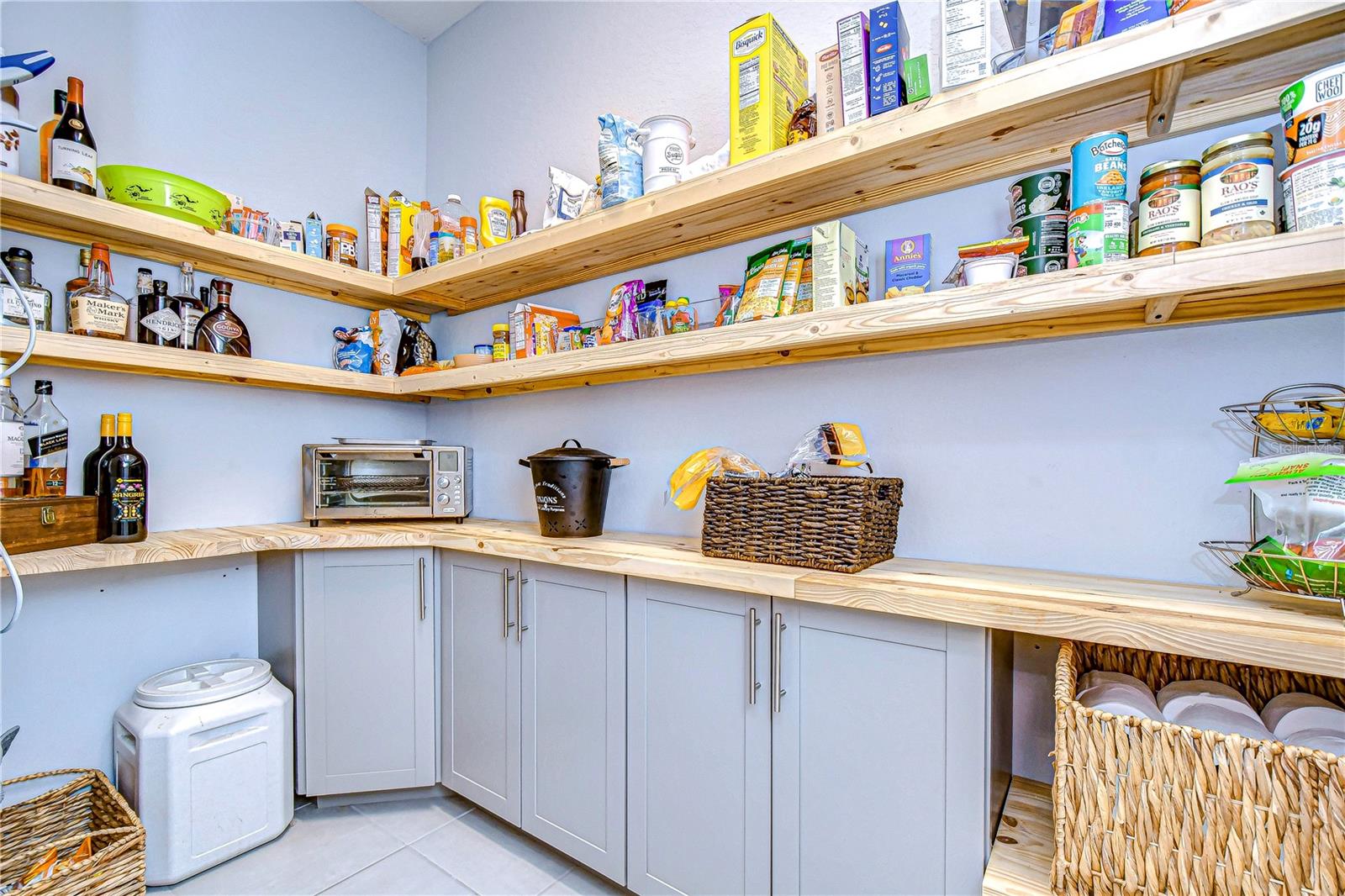 EXPANSIVE walk in pantry offers plenty of storage space for food and appliances.