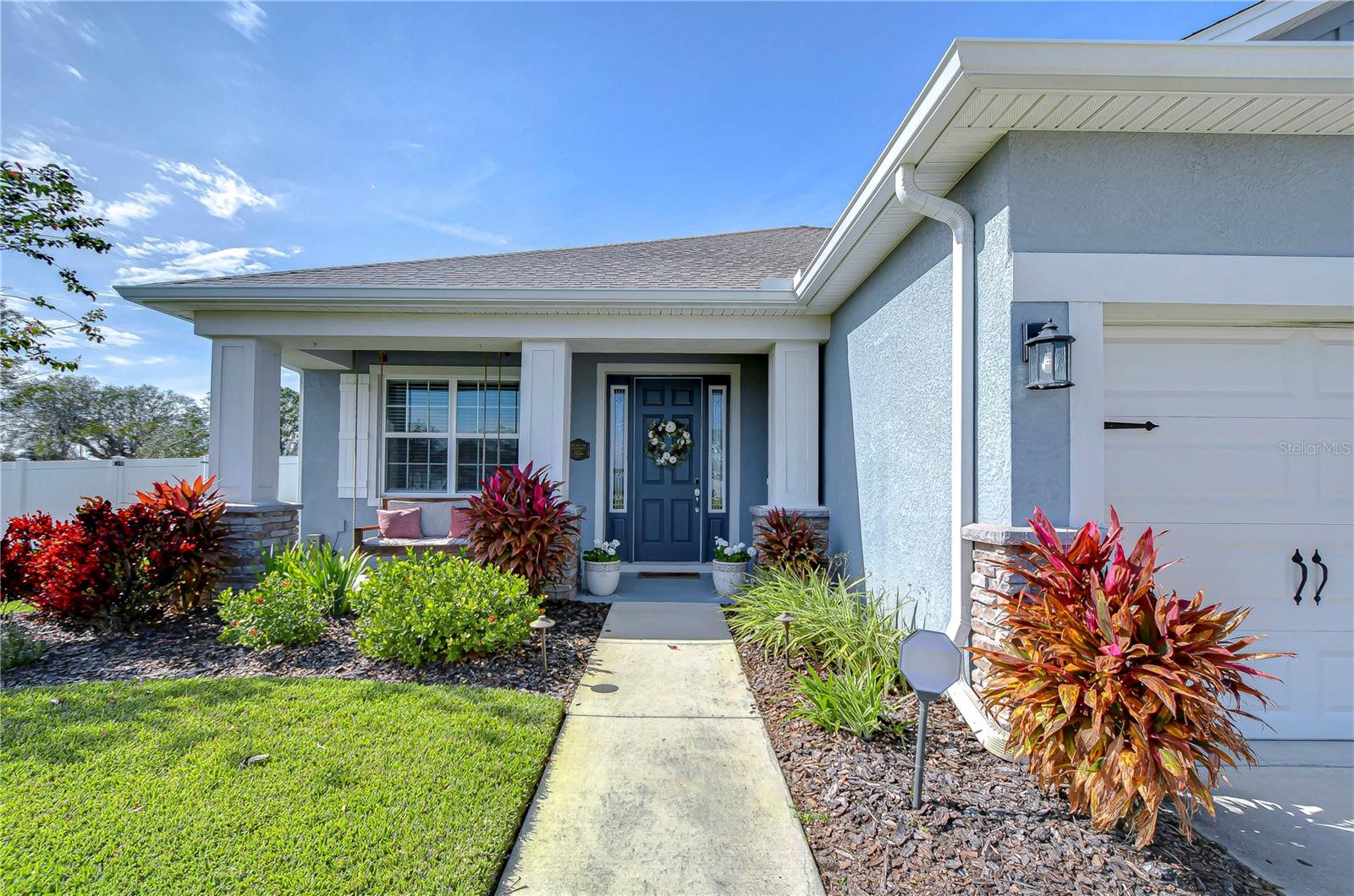 Beautiful curb appeal with well-manicured landscaping and 3 car garage!