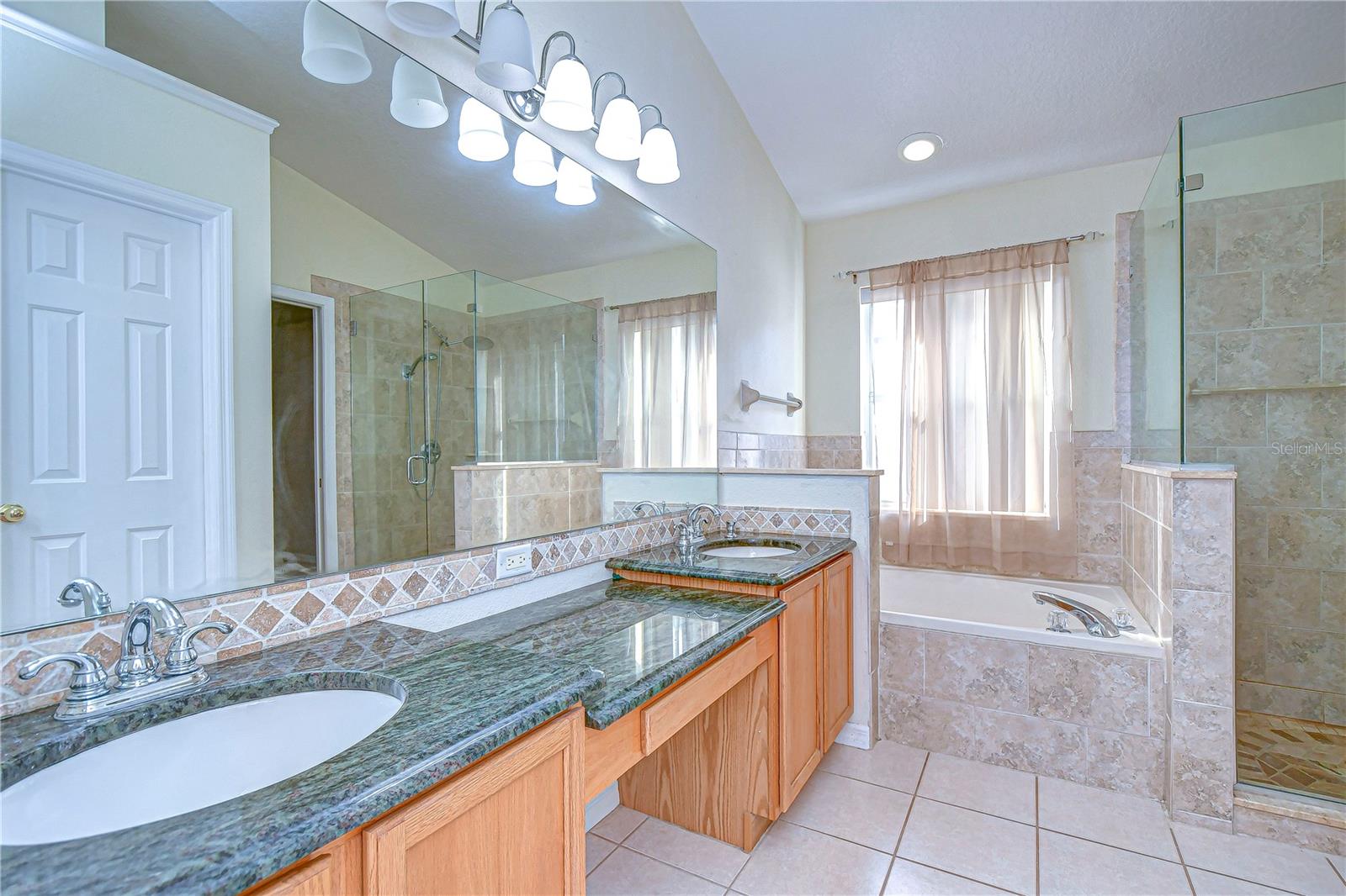 Primary bath features vanity and dual sinks!