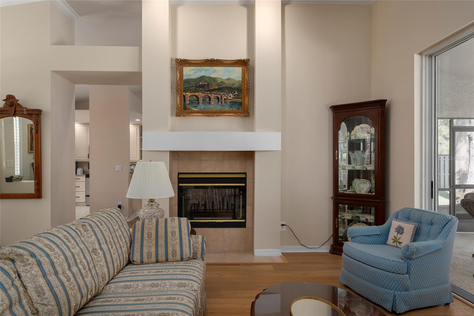 Living Room with fireplace w Pool View