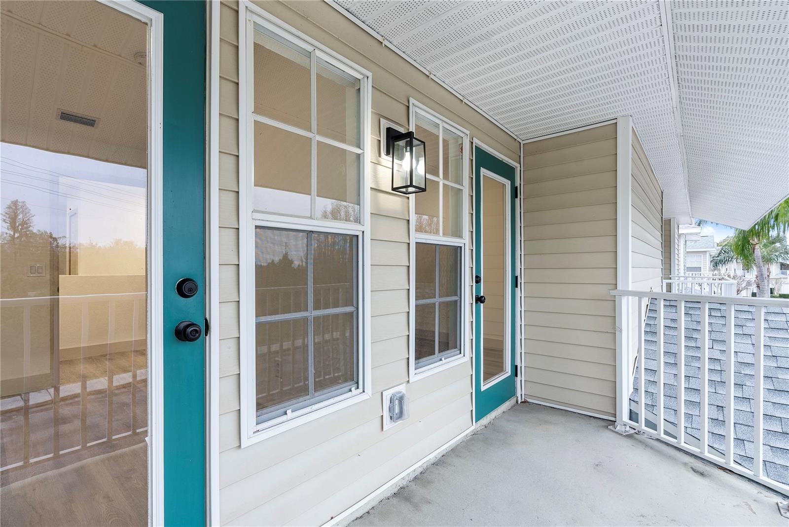 Doors From Bedroom 2 And Bedroom 3 Opening Onto A Shared Porch.