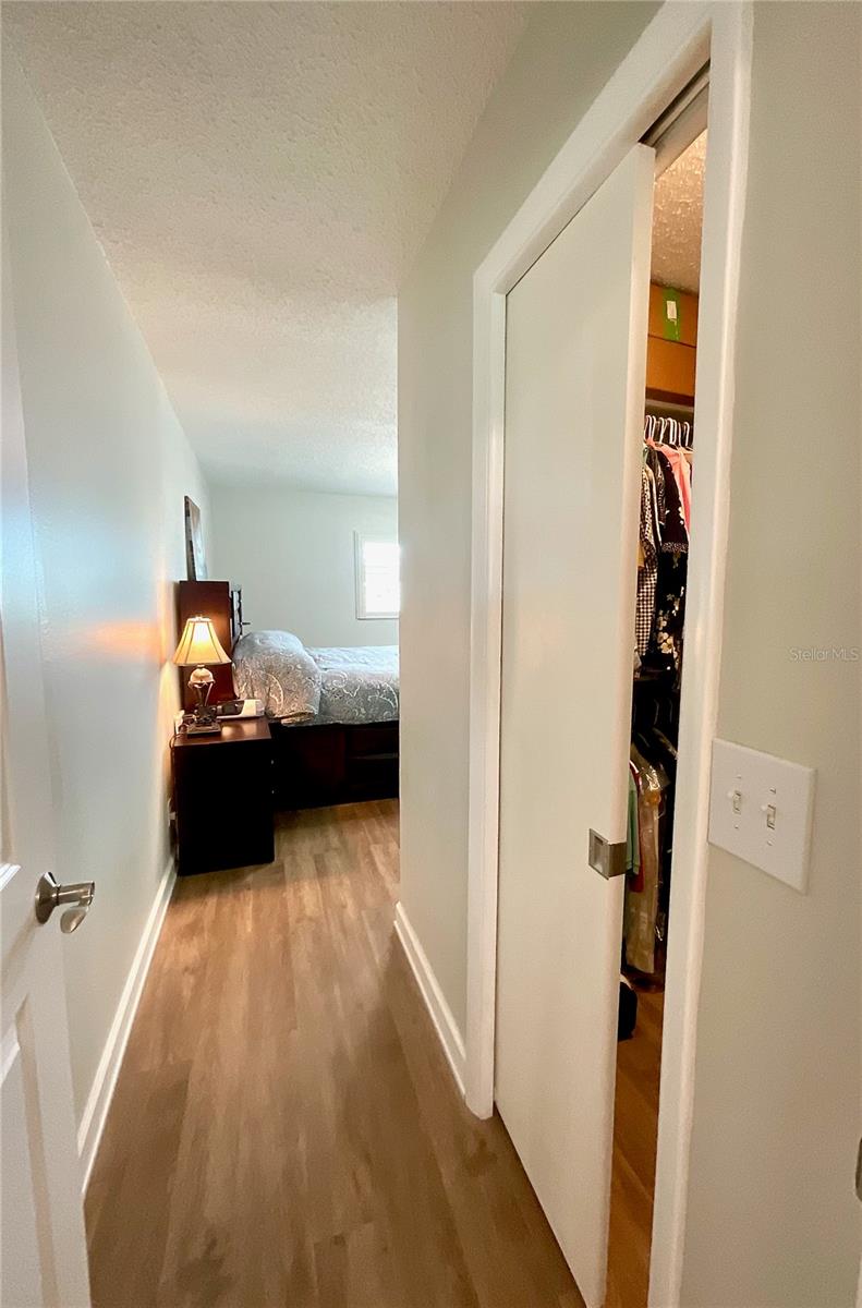 34-Primary bedroom entry with walk-in closet to right