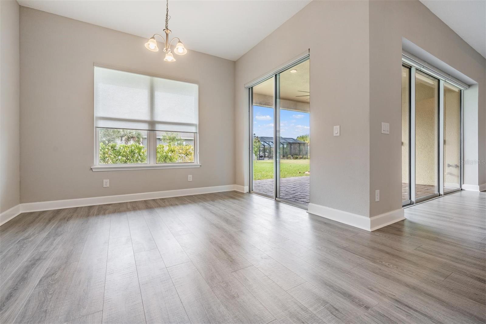 Dining room space adjacent to kitchen with slider access to back covered patio