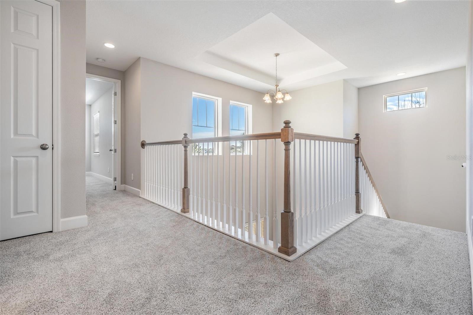 Upstairs hall with views to entry below