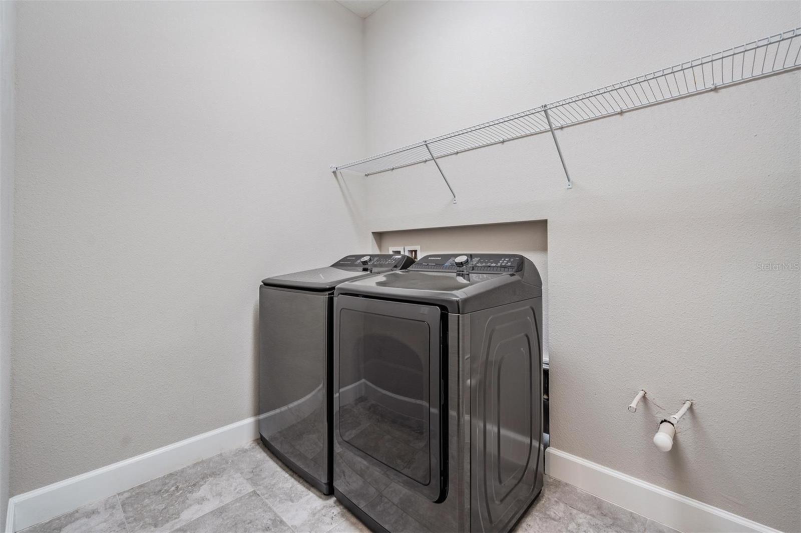 Laundry room with shelving, washer and dryer stay!