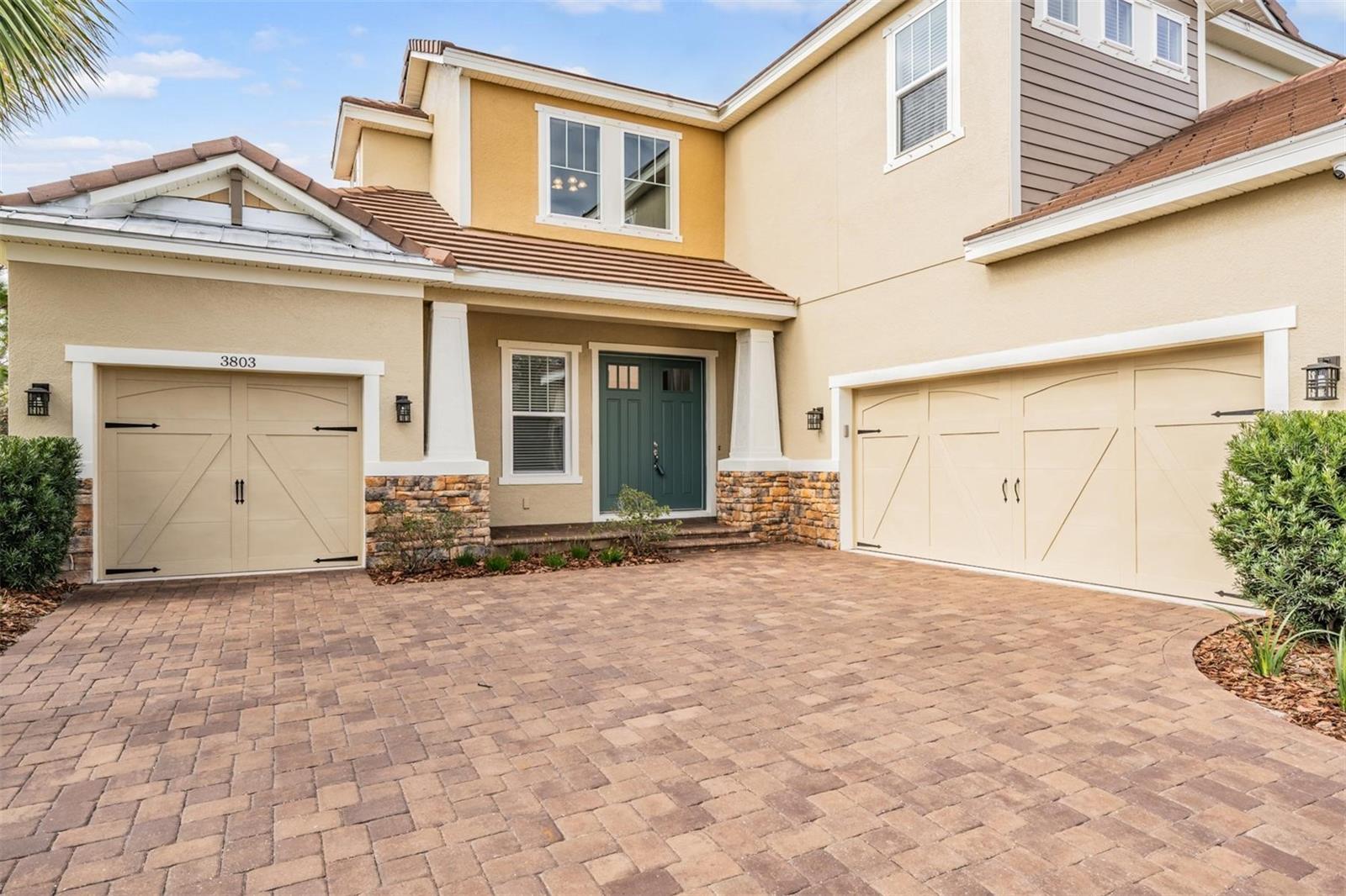 Courtyard driveway with split garages