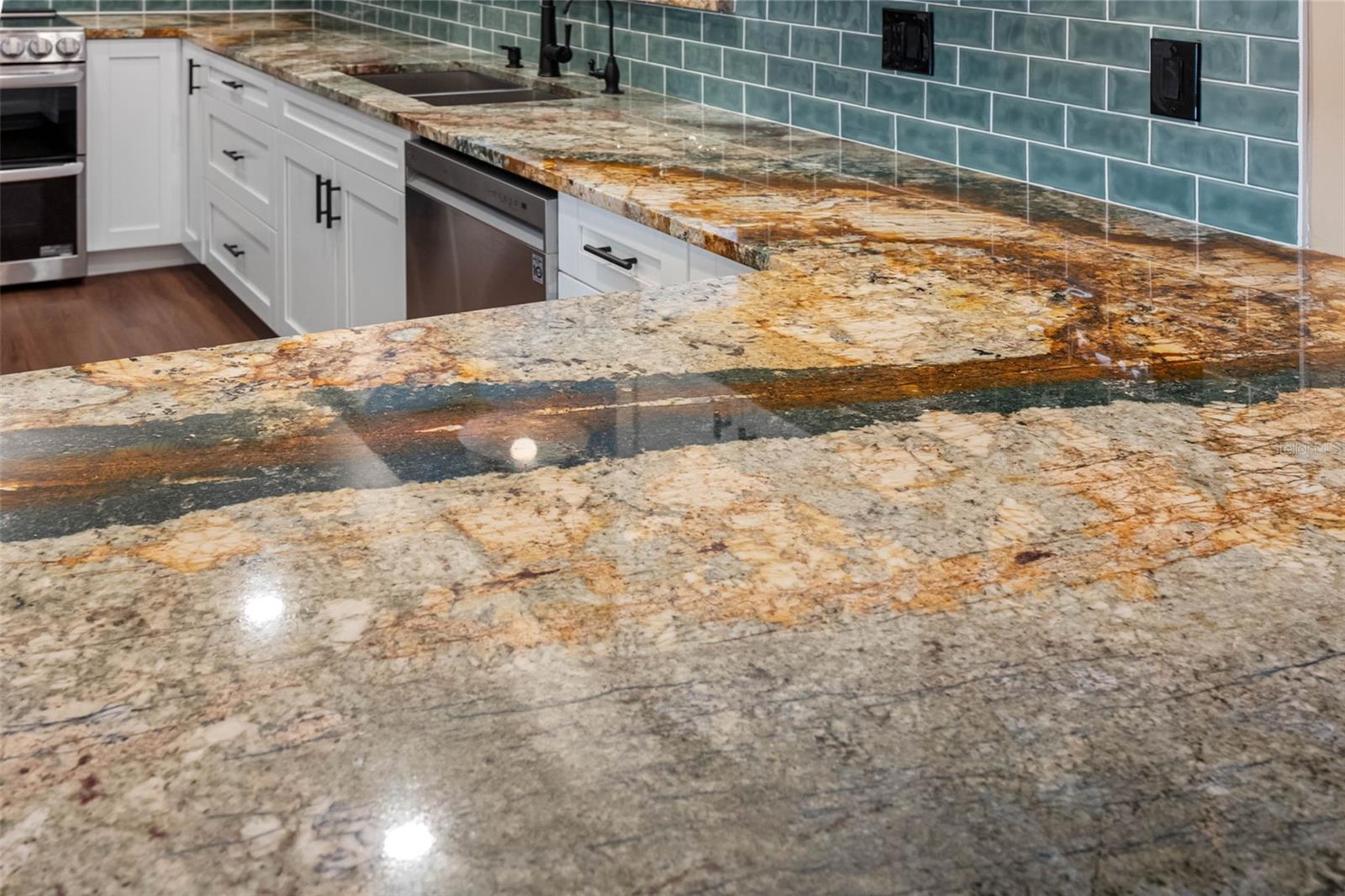 Amazing granite counters and tile backsplash.