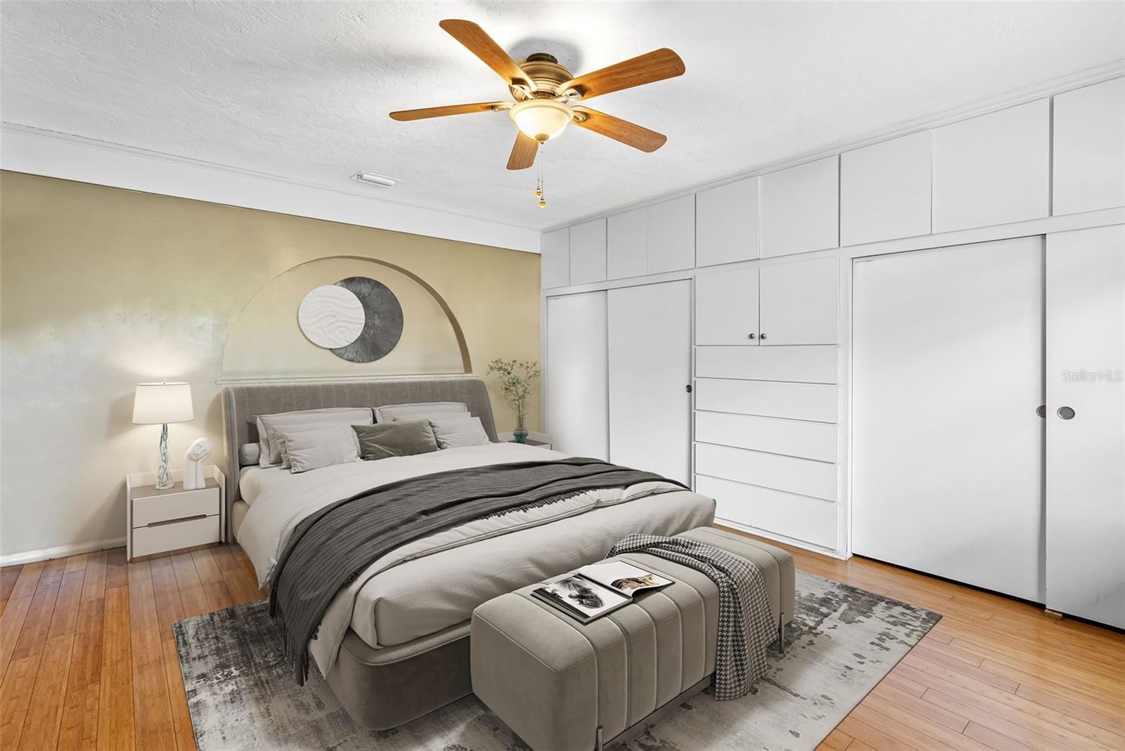 Bamboo flooring and soft natural light make the primary bedroom a peaceful retreat.