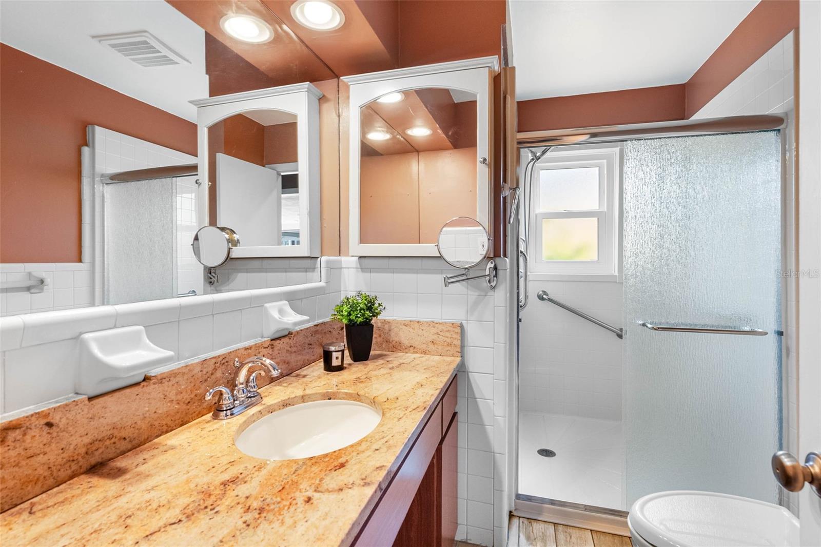 Hall bathroom with granite counters.